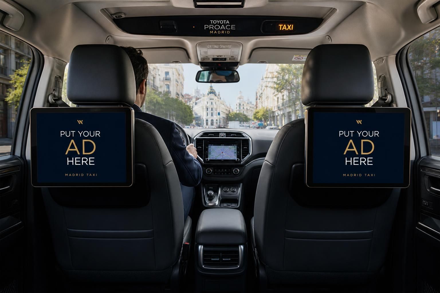 Two digital advertising screens mounted on the headrests inside a white Toyota Proace Madrid taxi, each showing 'Put your ad here'